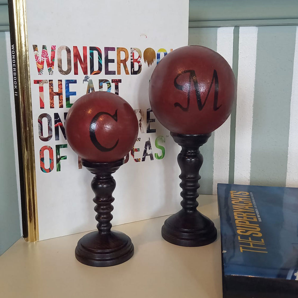 Red Spheres On Pedestal