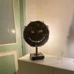 Trippy - Tortured brass emoticon on wooden base by Razeto Giangi - Fp Art Online